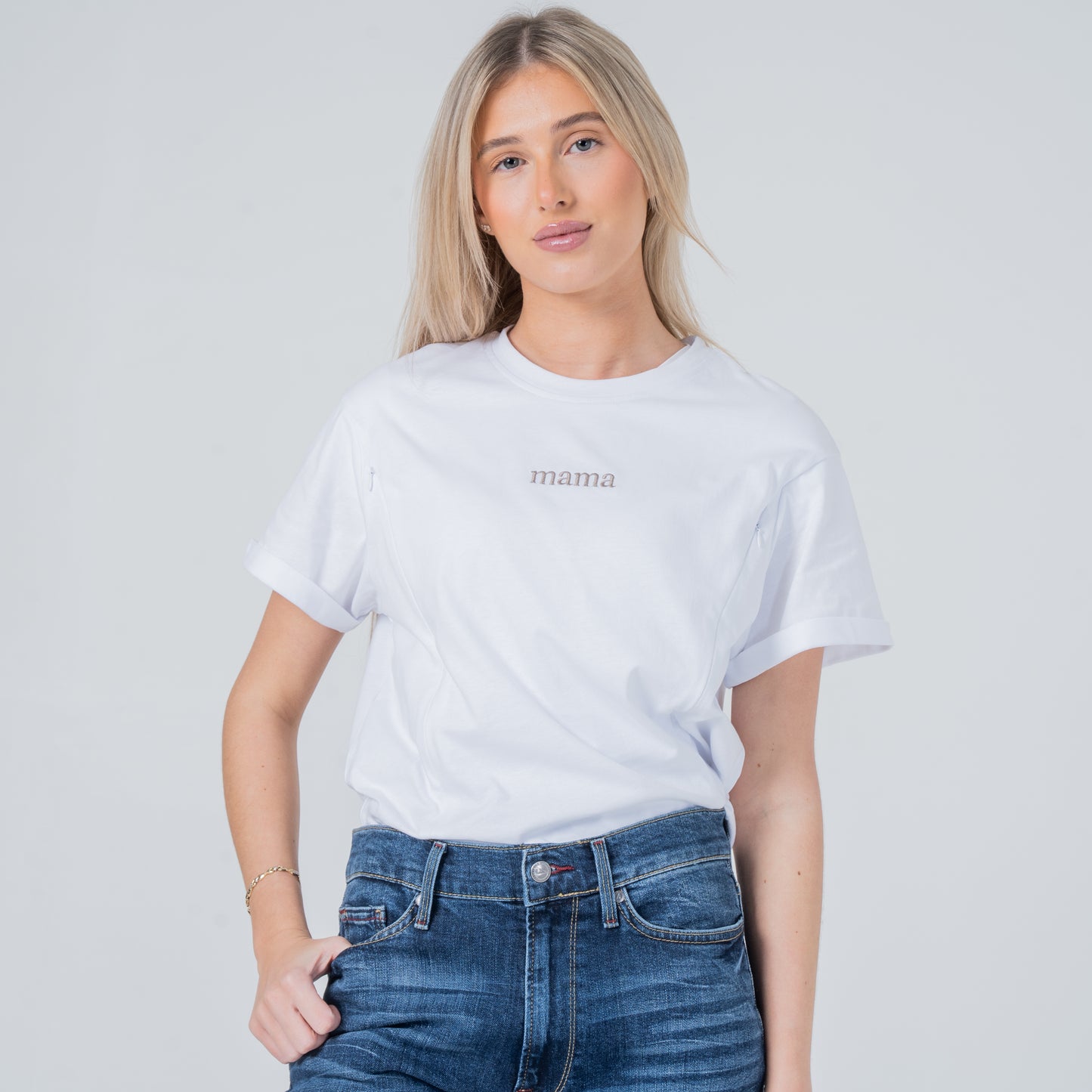 woman wearing milkmates white mama nursing tee front tucked in