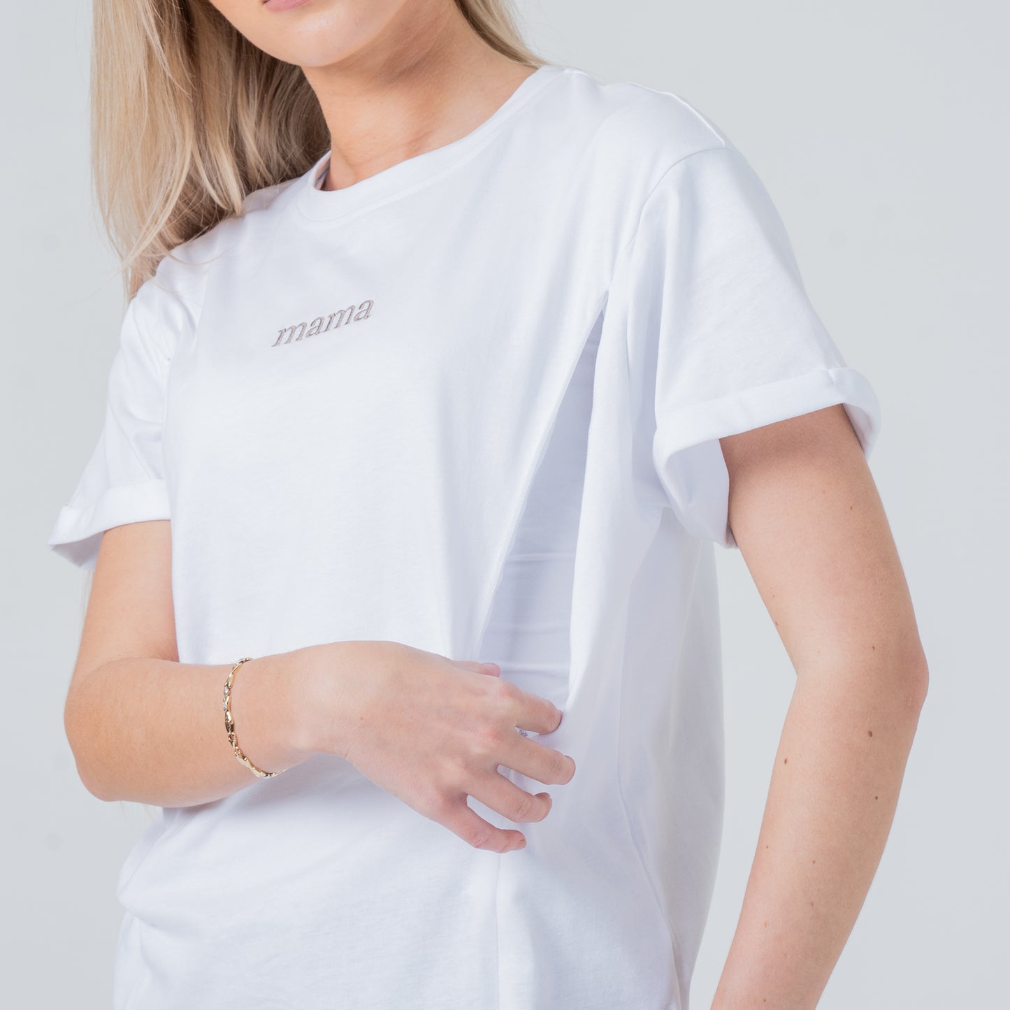 woman wearing milkmates white mama nursing tee side view zipper open